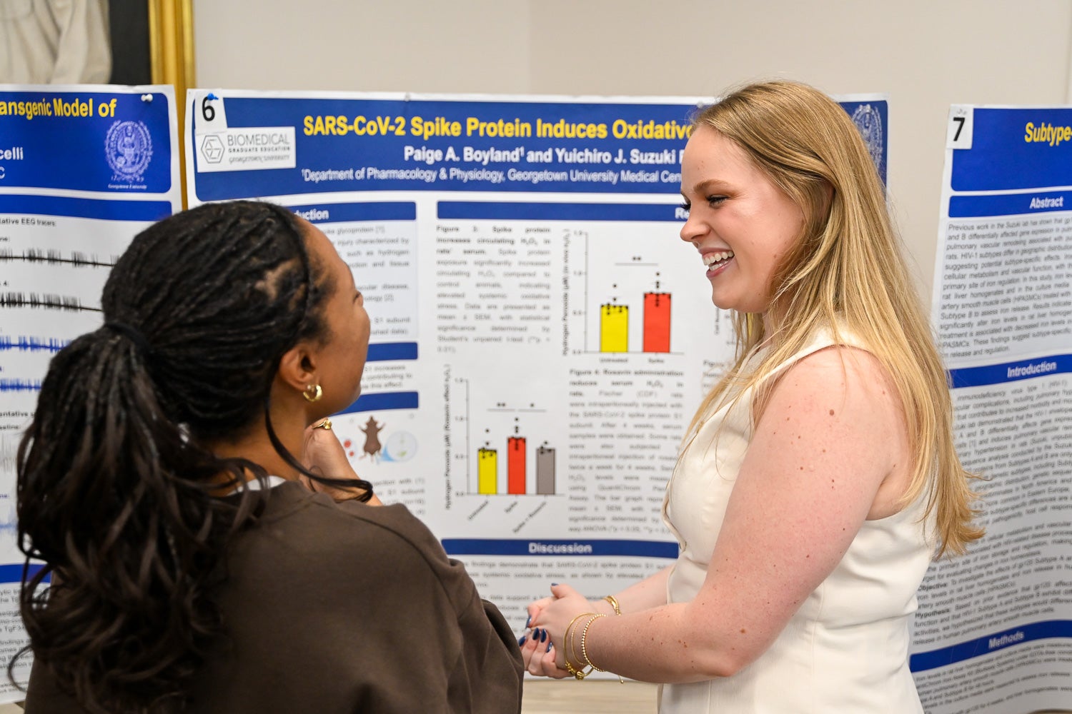 A student presents research at Pharmacology & Physiology Poster Day