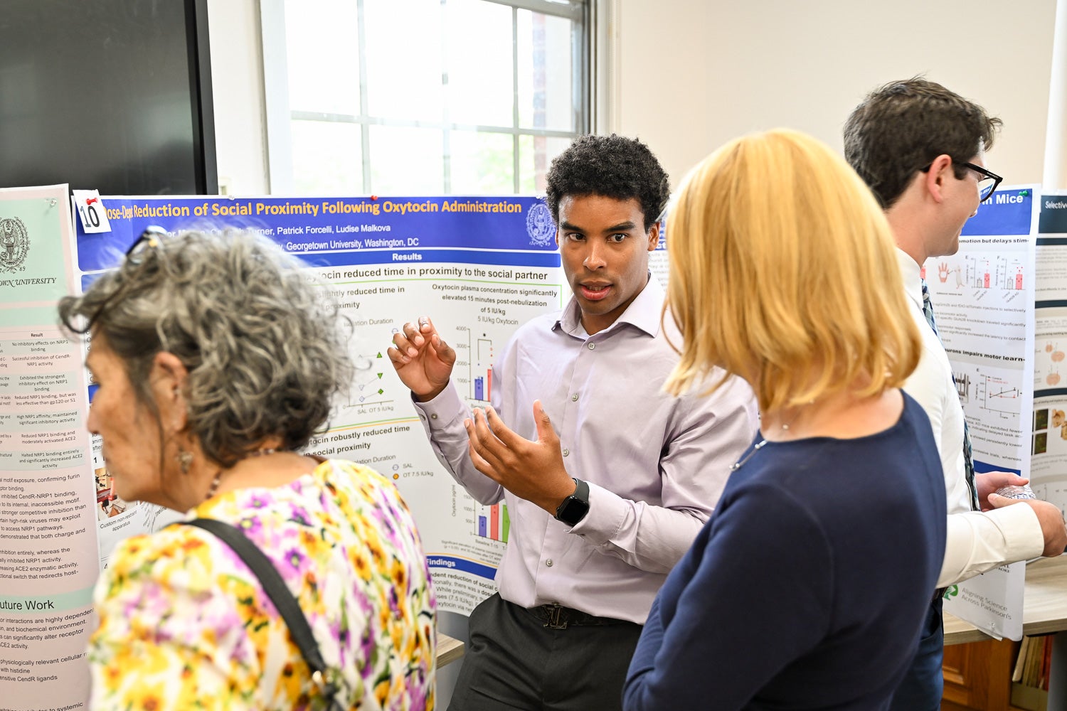 A student presents research at Pharmacology & Physiology Poster Day