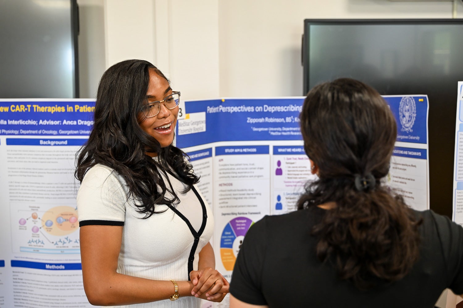 A student presents research at Pharmacology & Physiology Poster Day