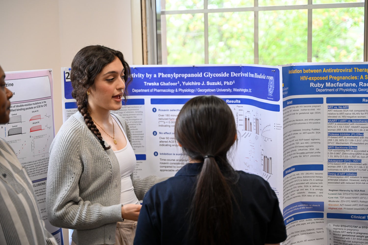 A student presents research at Pharmacology & Physiology Poster Day