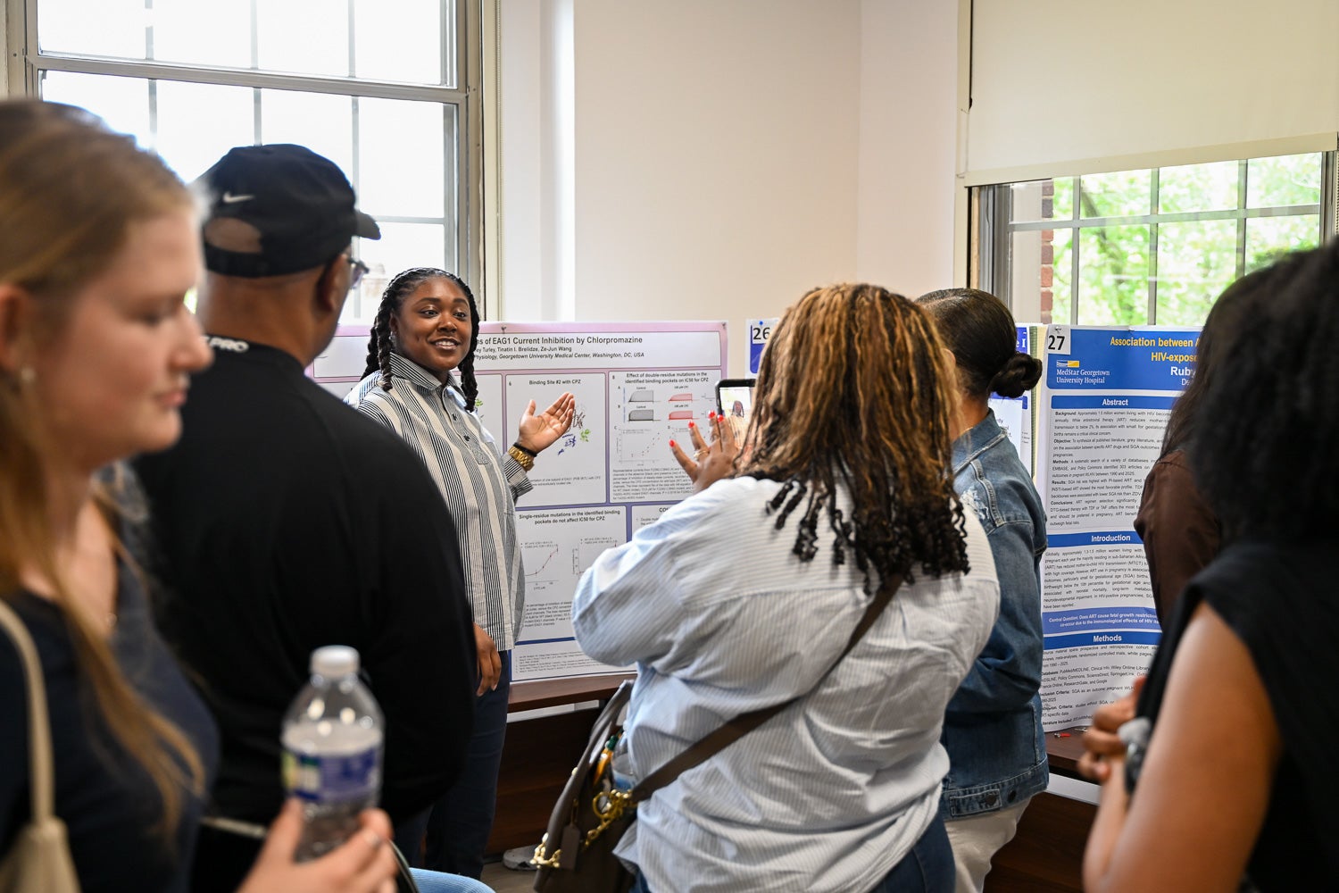 A student presents research at Pharmacology & Physiology Poster Day