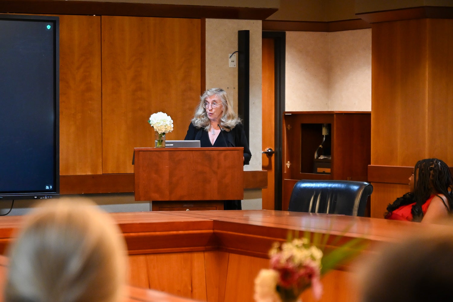 Jill Smith speaks from the lectern at the Systems Medicine Gala