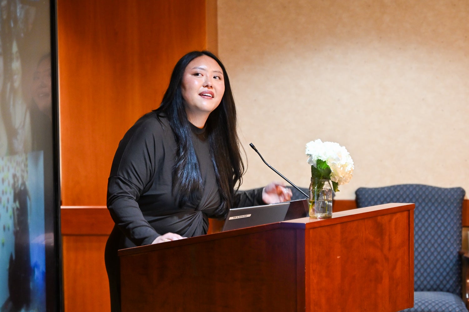 A student speaks at the lectern at the Systems Medicine Gala