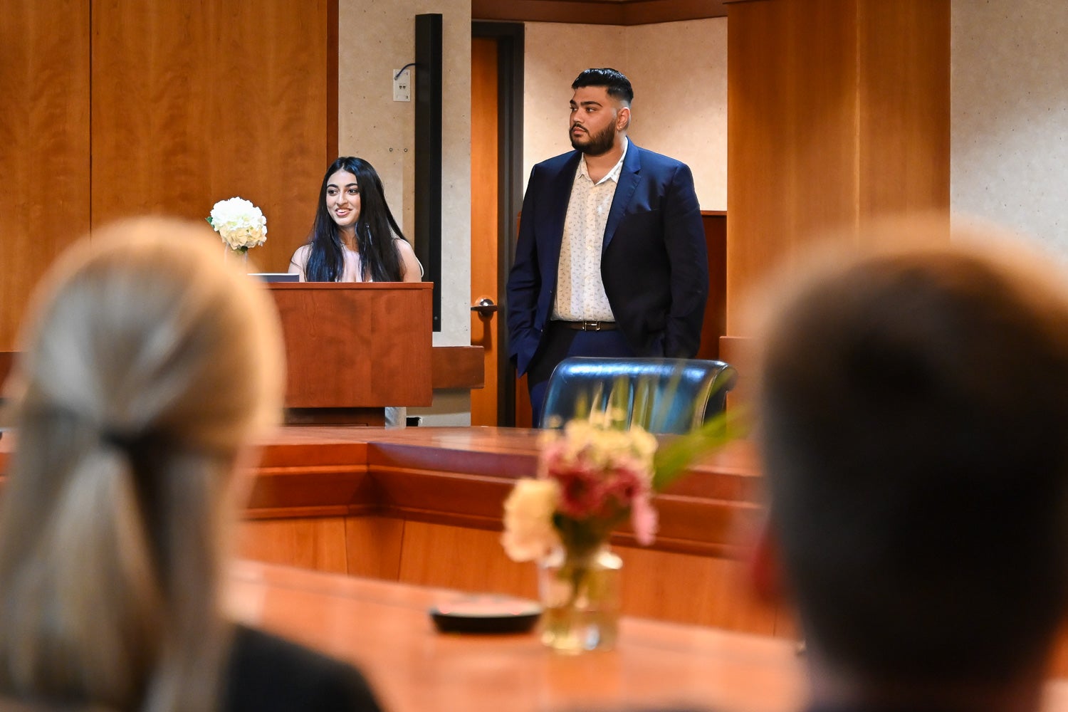 Students speak from the lectern at the Systems Medicine Gala